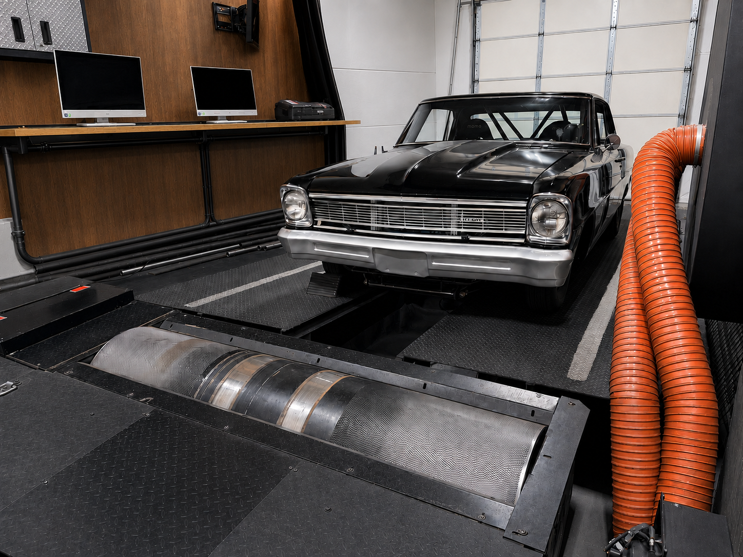 Classic muscle car on a chassis dynamometer in a performance shop